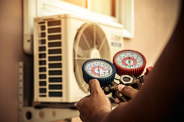 Professional Heat Pump Repair technician working in Parma, ID